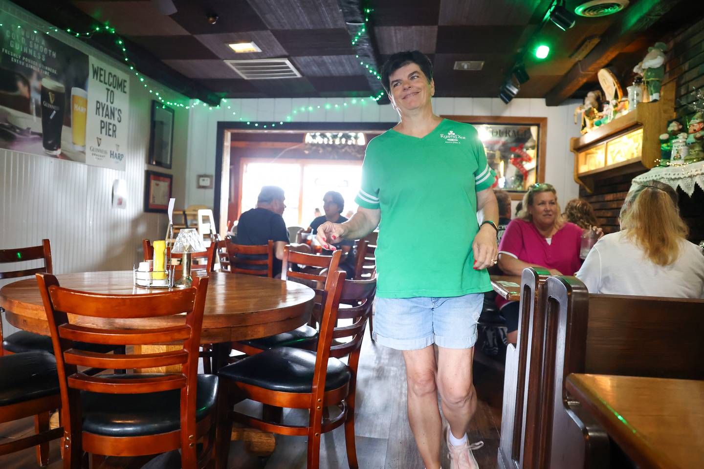 Kathleen Slavin, co-owner of Ryan's Pier, helps serve tables during the lunch rush on Tuesday, Aug. 12, 2025, at the Aroma Park business. The restaurant has been celebrating its 40th anniversary this year.
