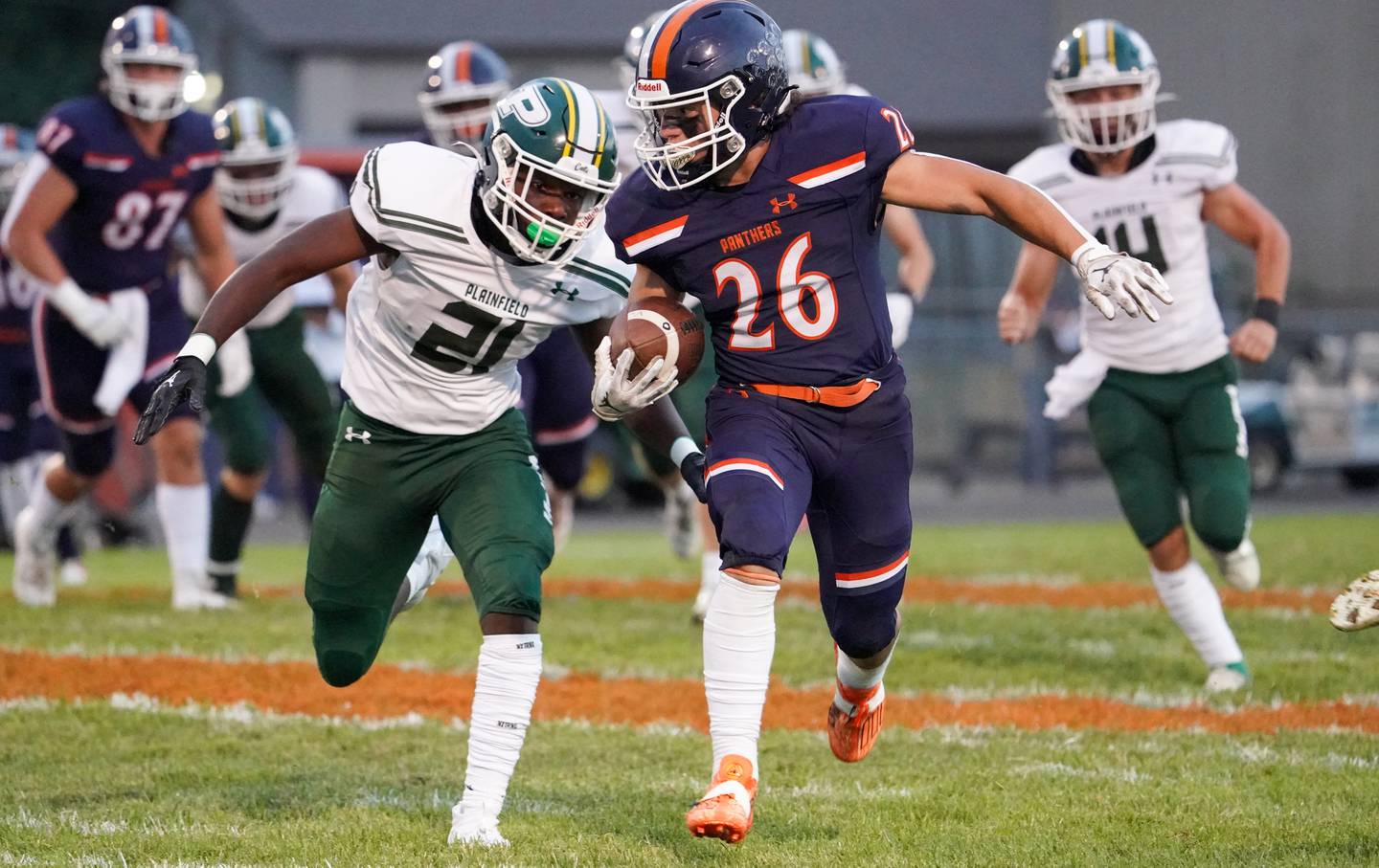 Oswego’s Noah Vera (26) carries the ball against Plainfield Central's Javar Jones (21) during a football game at Oswego High School on Friday, Sept. 8, 2023.
