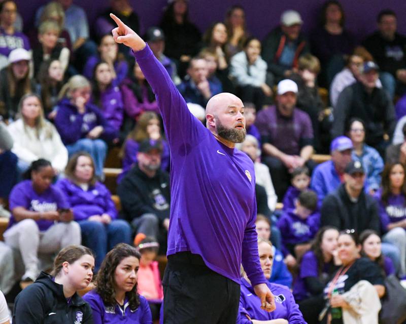 Downers Grove North's head coach Stephen Bolt coaches from the bench during the 4A regional championship game on Thursday Feb. 19, 2026, while taking on St. Laurence held at Downers Grove North High School.
