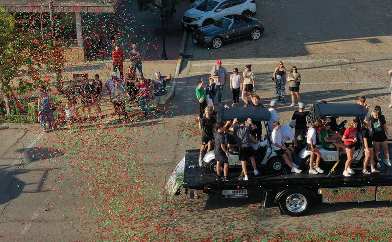 Confetti rains down on top of the L-P golf team during the homecoming parade on Thuesday, Oct. 2, 2025 downtown La Salle.