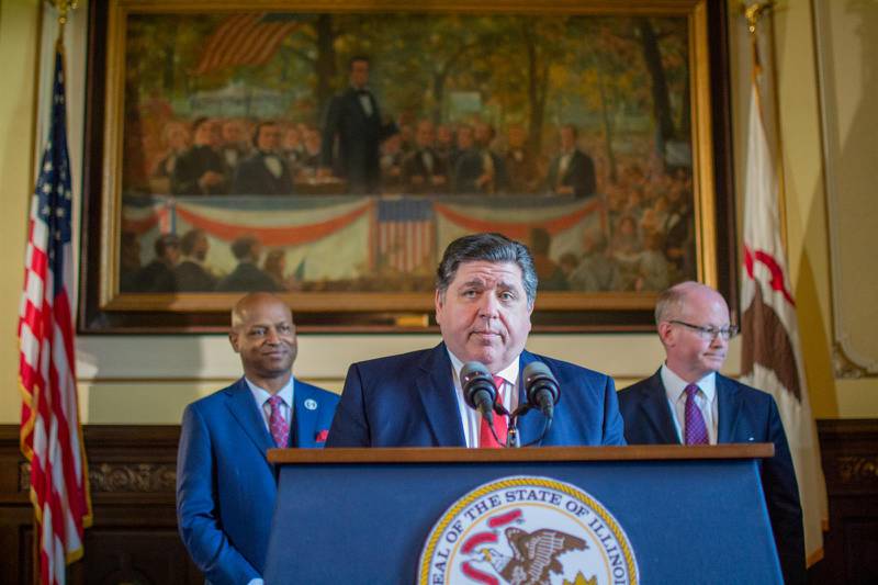Gov. JB Pritzker, House Speaker Emanuel "Chris" Welch and Senate President Don Harmon appear for a rare joint news conference on Wednesday, May 24, 2023, in the Capitol to announce a budget framework for next year.