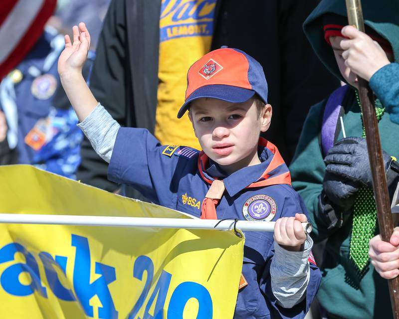 A little boy with the Lemont Cub scout pack 249 march in the Lemont St. Pat's Day Parade on Saturday, March 8, 2025  in Lemont