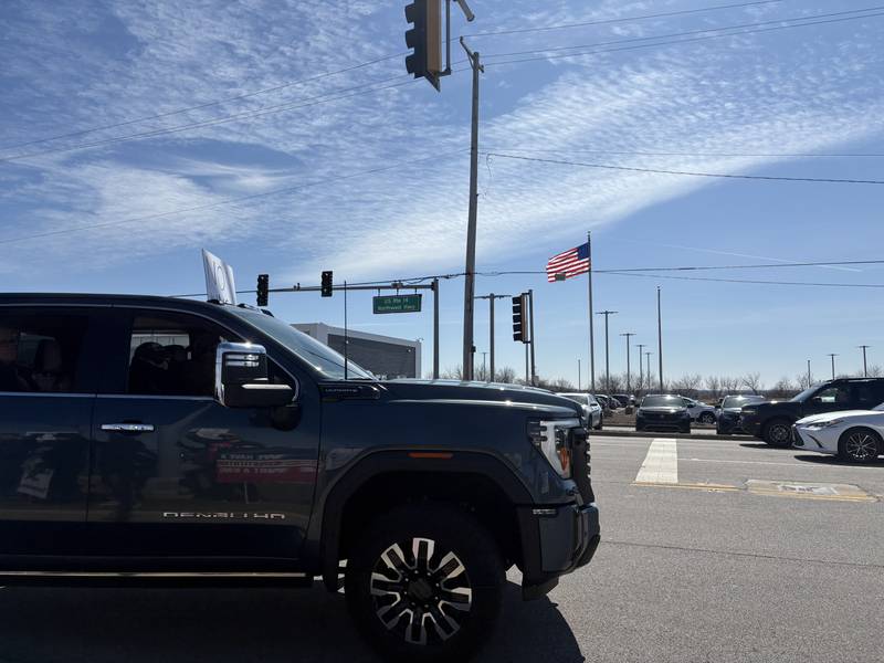 A car displays a sign of support at a No Kings rally in Crystal Lake, Saturday, March 28, 2026.