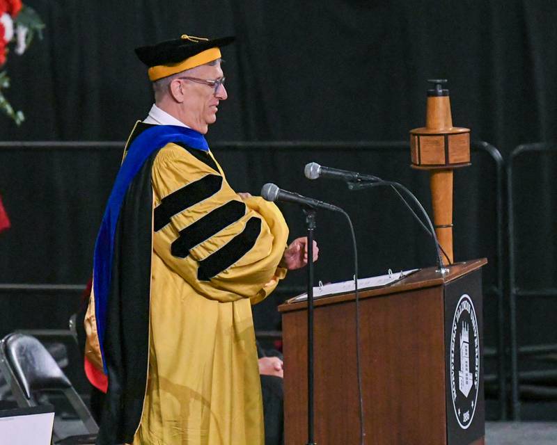 Northern Illinois University Dean of College of Liberal Arts and Sciences Robert Brinkmann speaks during the graduation ceramony on Saturday May, 9. 2026, held at the Convocation Center in DeKalb.