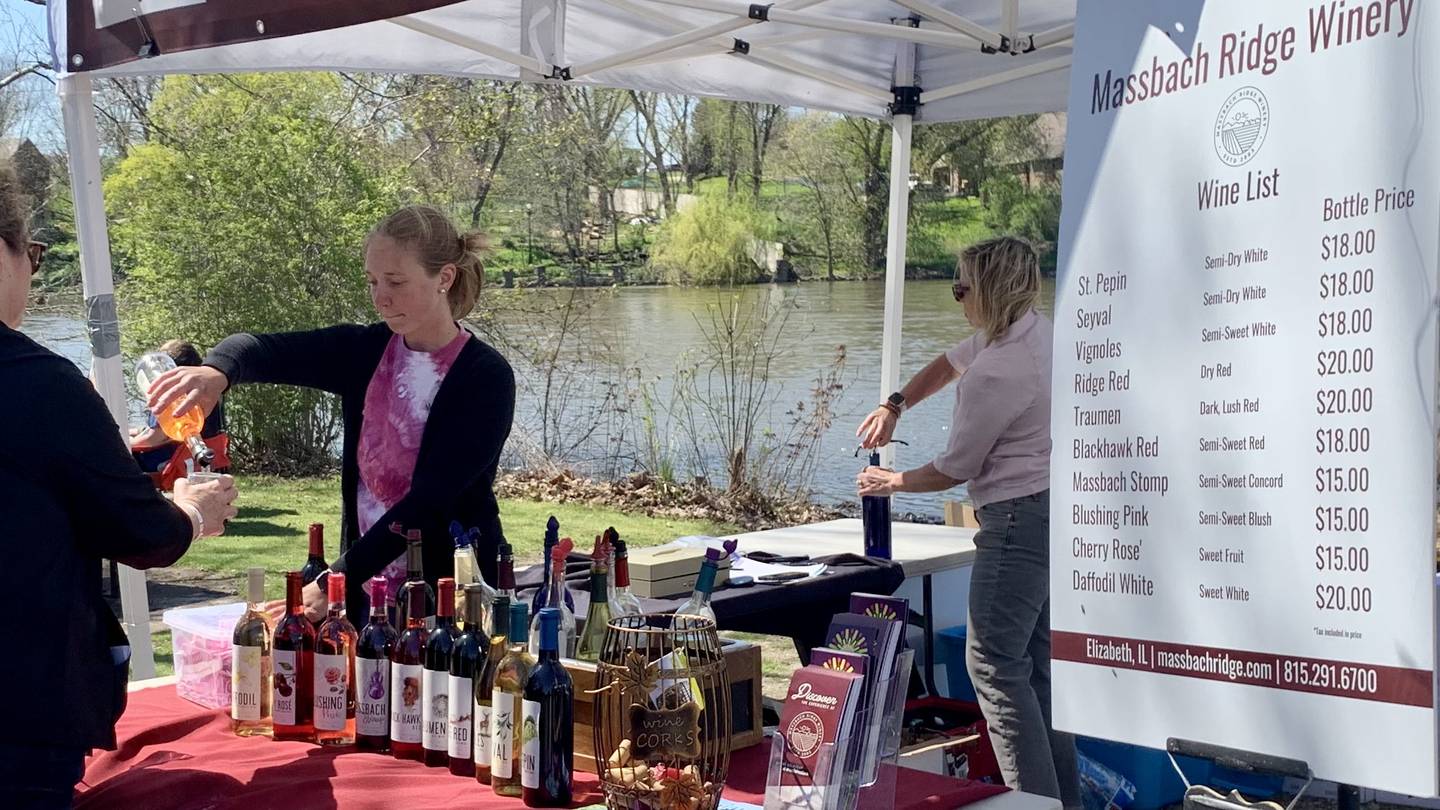 Massbach Ridge Winery serving a variety of their wines at the annual Wine on the Fox event at Hudson Crossing Park downtown Oswego May 7 and 8.