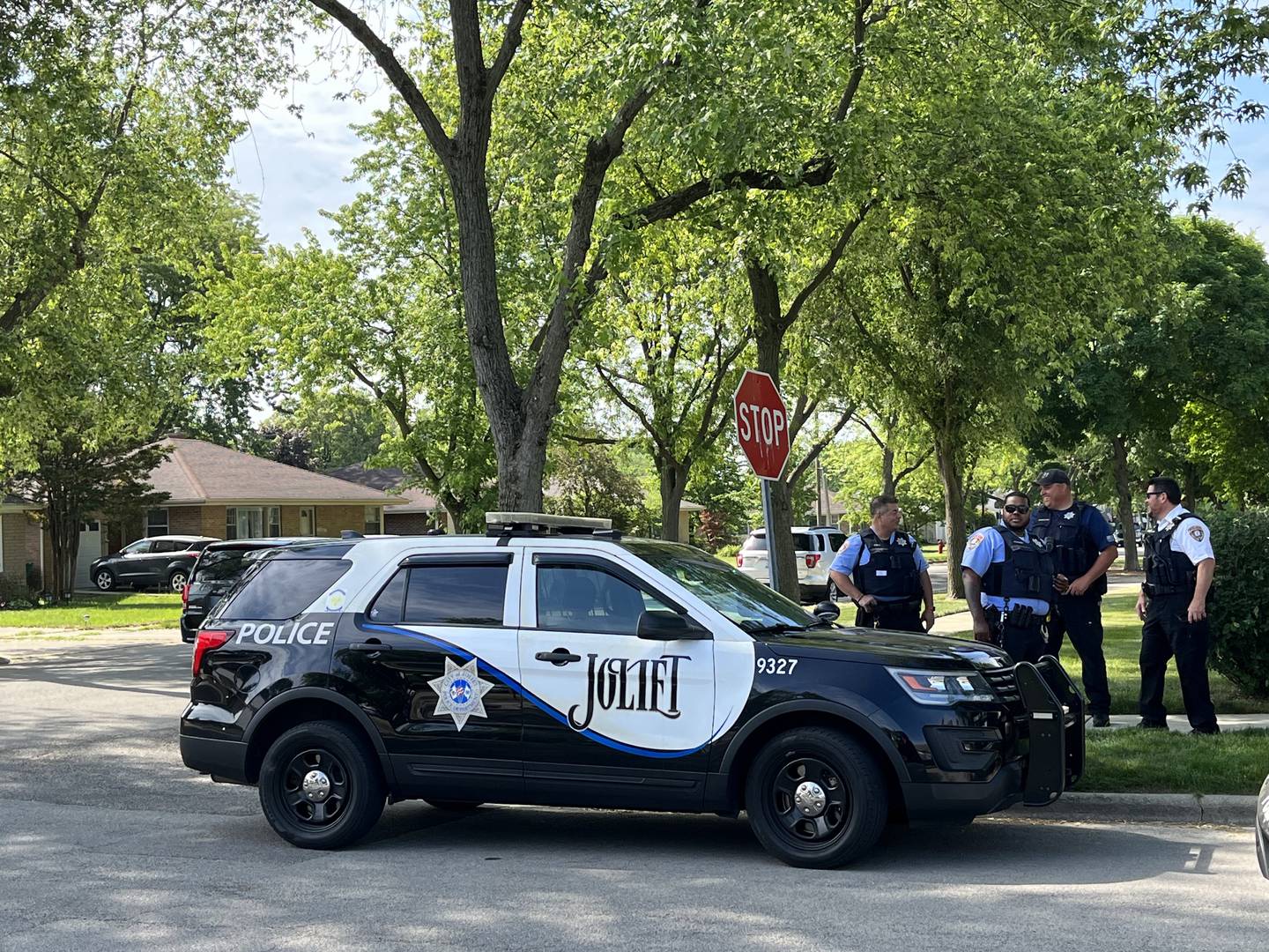 Joliet police officers at the intersection of Caton Avenue and Catherine Street on Tuesday, May 30, 2023.