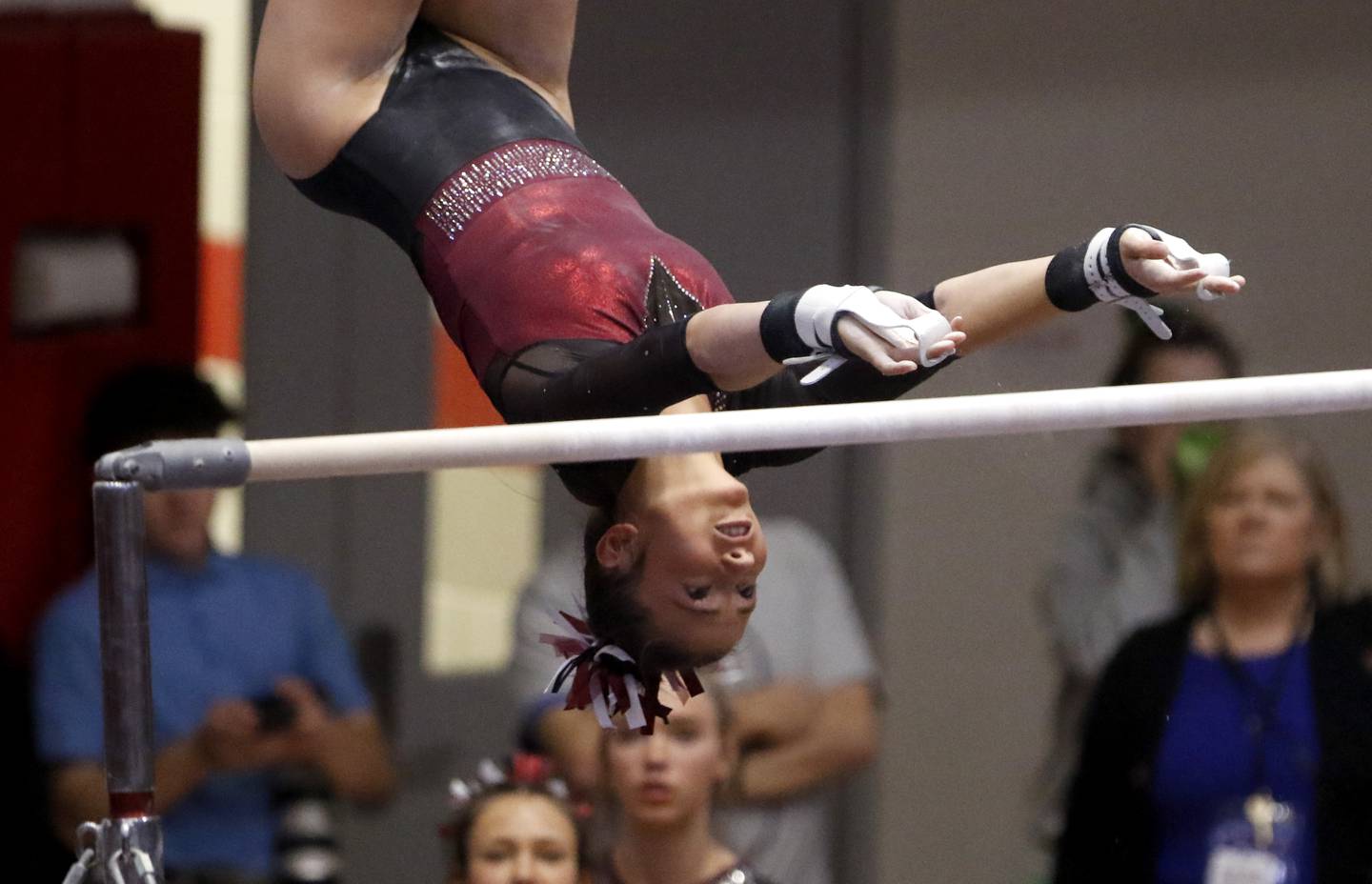 Prairie Ridge's The Scheuer competes in the preliminary round of the uneven parallel bars  on Friday, Feb. 21, 2025, during the IHSA Girls State Final Gymnastics Meet at Palatine High School.