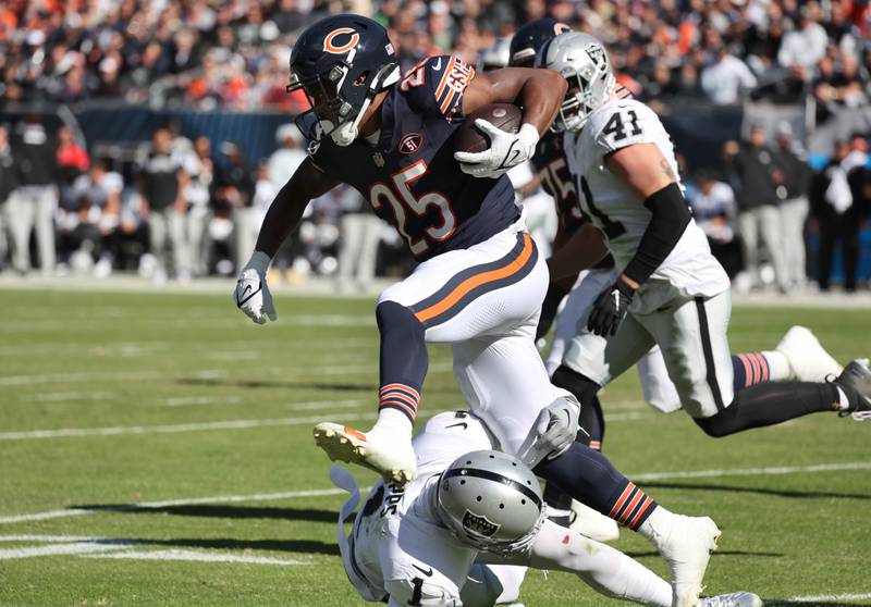 Chicago Bears running back Darrynton Evans hurdles Las Vegas Raiders safety Marcus Epps during their game Sunday, Oct. 22, 2023, at Soldier Field in Chicago.