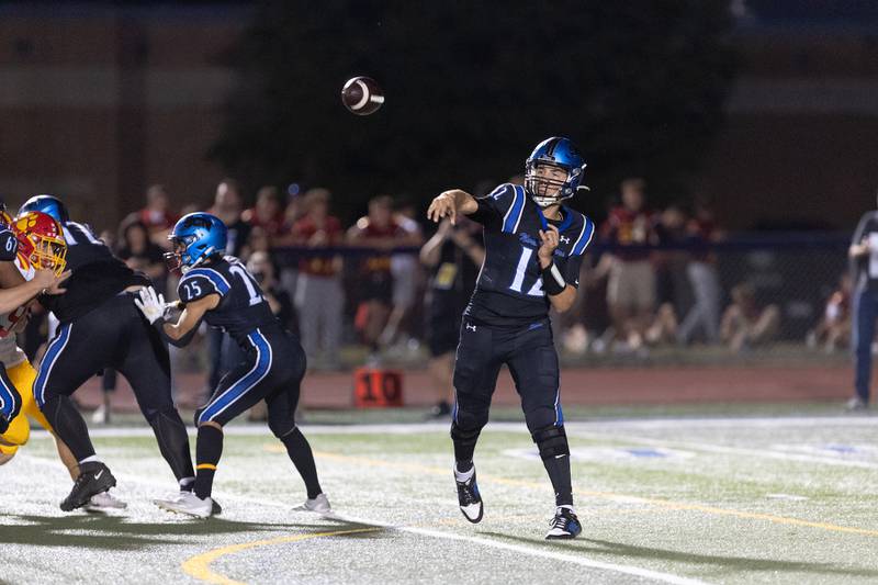 St. Charles North's  JT Padron throws a pass against Batavia on Friday, Sept. 26, 2025 in St. Charles.