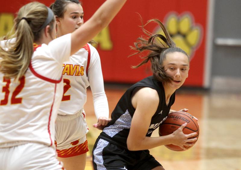 St. Charles North’s Laney Stark (right) looks for an opening during a game at Batavia on Thursday, Jan. 12, 2023.