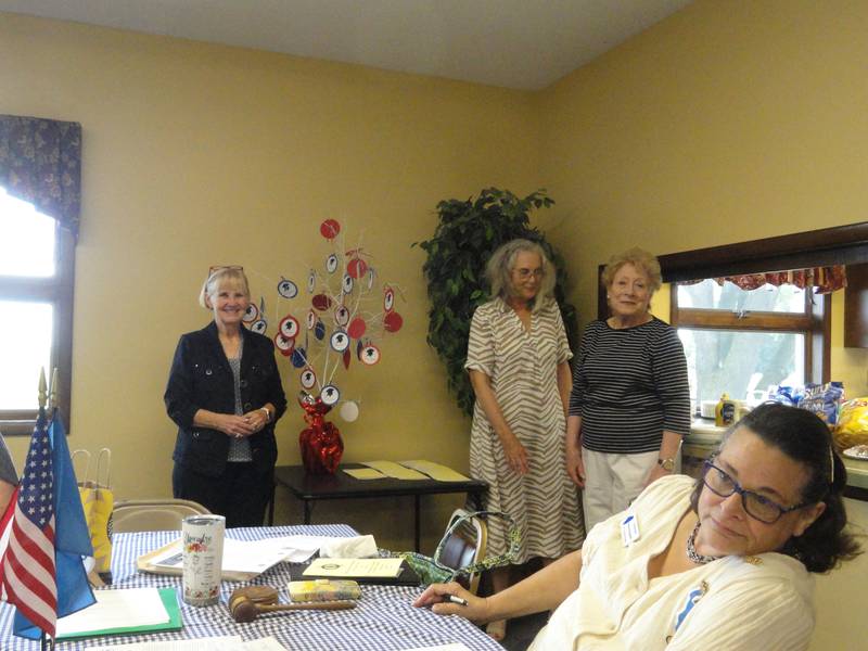 Ruth Meinhardt (center) welcomes Aug. 17, 2024, new members Cheryl Mooney Midnight and Sharon Spinks Presse to the Fort du Rocher Chapter of the Daughters of the American Revolution.