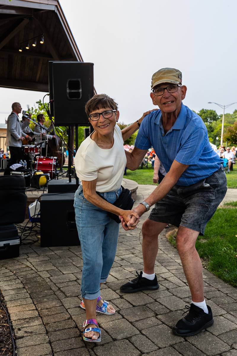 Lombard residents Barb and Chuck Klein dance to music as The Neverly Brothers perform in Lockport's Central Square on June 2, 2025.