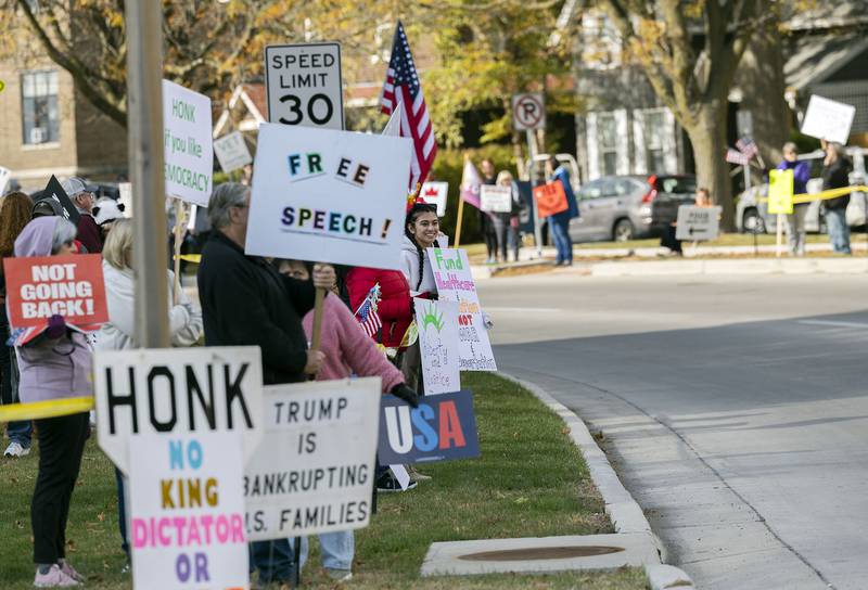 Protestors line up along Fourth Street in Sterling Saturday, Nov. 1, 2025, for another round of No Kings rallies.