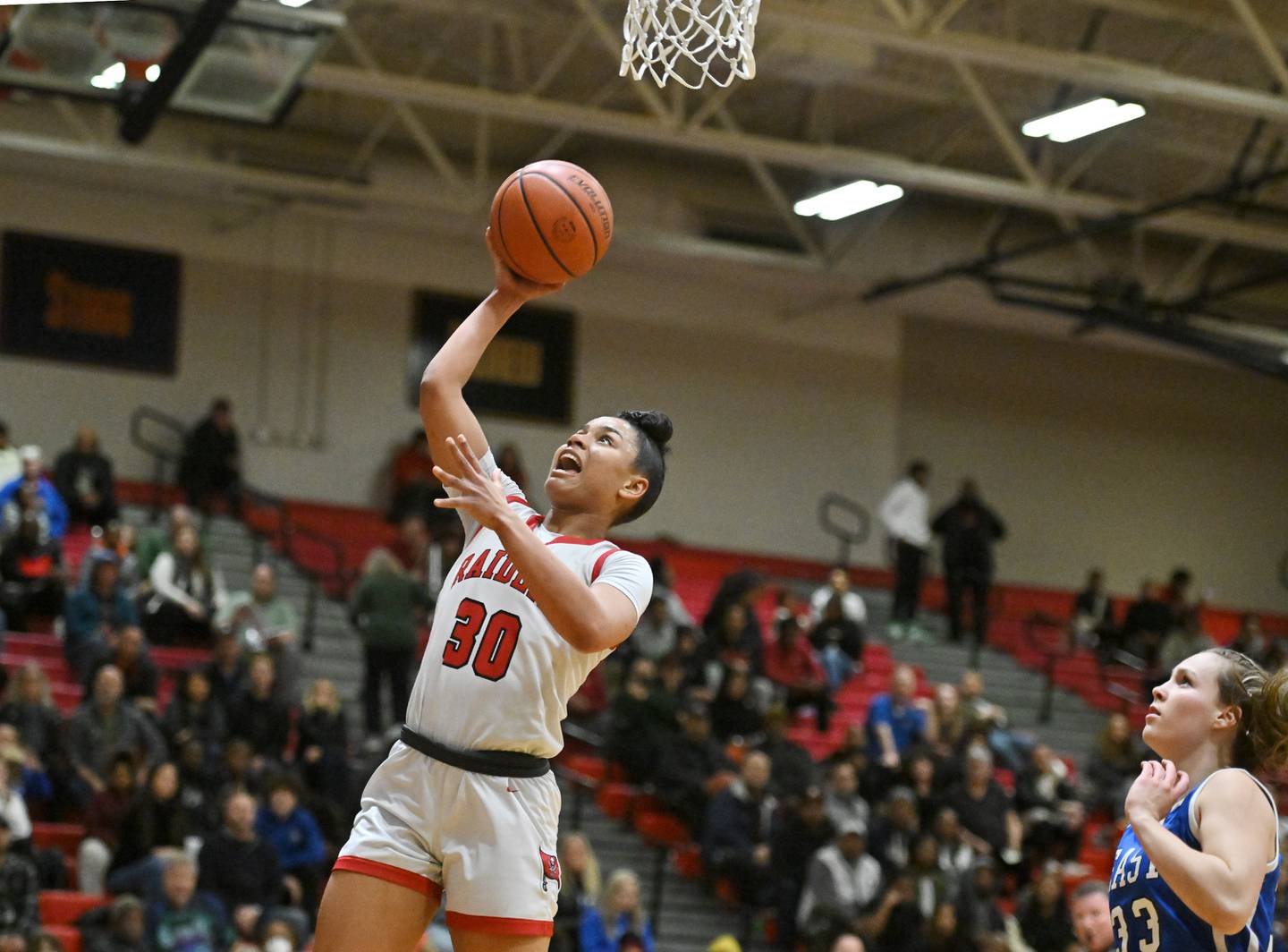Bolingbrook's Angelina Smith (30) shoots a layup during a conference game against Lincoln-Way East on Tuesday, Dec. 19, 2023, at Bolingbrook. (Dean Reid for Shaw Local News Network)