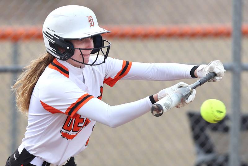 DeKalb’s Megan Gates lays down a sacrifice bunt during their game against Rockford Auburn Wednesday, March 15, 2023, at DeKalb High School.