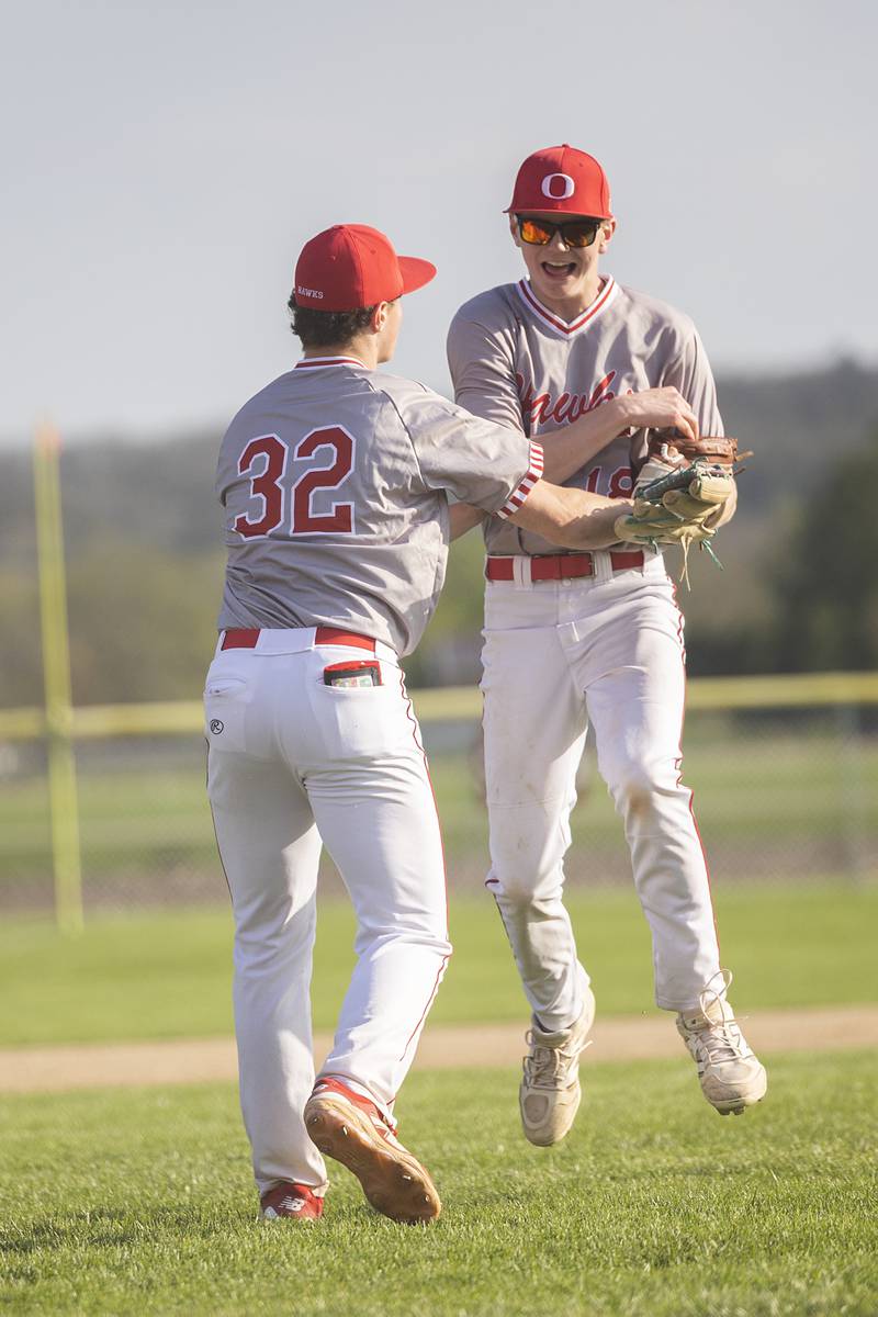 Oregon’s Nick Ciesiel (left) and Landon Ziller celebrate an out against Dixon Thursday, April 23, 2026.