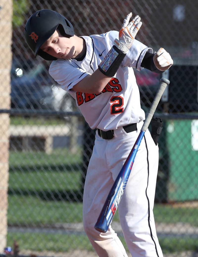 DeKalb's Jack Ager flips his bat after drawing a walk forcing in a run during their game against Naperville Central Tuesday, April 30, 2024, at DeKalb High School.