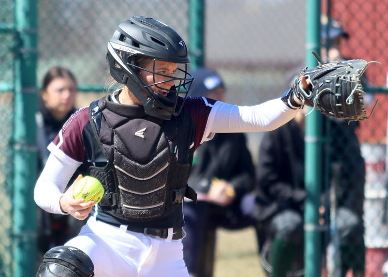 Marengo’s catcher Kylee Jensen keeps an eye on the action against North Boone in varsity softball at Marengo High School in Marengo on Saturday, March 22, 2025.