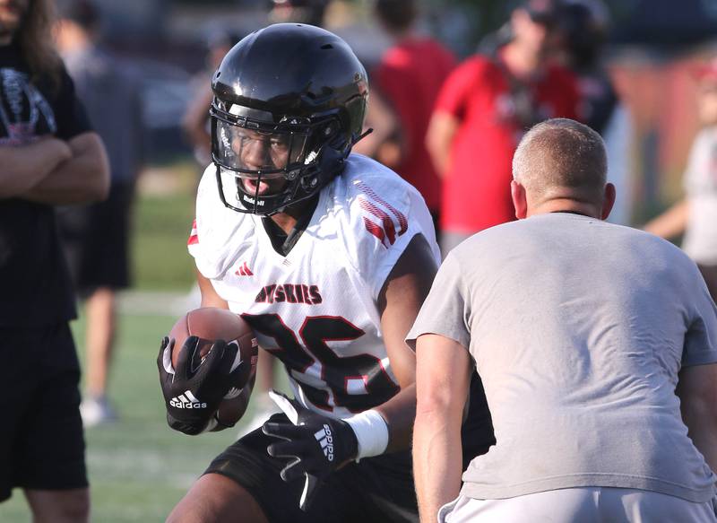 Northern Illinois Huskies running back Kendrell Flowers runs the ball during a drill at the teams first practice of the season Wednesday, Aug. 2, 2023, at Huskie Stadium in DeKalb.