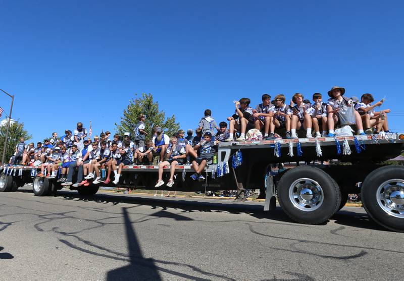 The Princeton youth football team rides on a float during the 52nd annual Homestead Festival parade on Saturday, Sept. 9, 2023 in Princeton.