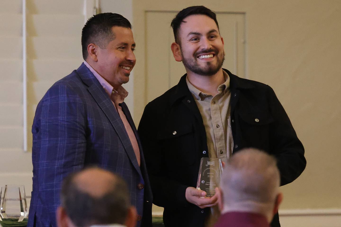 Joliet Councilman Cesar Cardenas presents Alex Paramo with his award for his charity work on behalf of the Joliet Latino Economic Development Association at the inaugural Joliet Philanthropy Recognition Awards Ceremony on Saturday, Oct. 5, 2024 at the Renaissance Center in Joliet.
