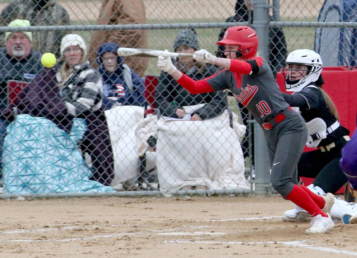 Ottawa's Ryleigh Stehl lays down a bunt against Serena on Tuesday, March 21, 2023 at Ottawa High School.