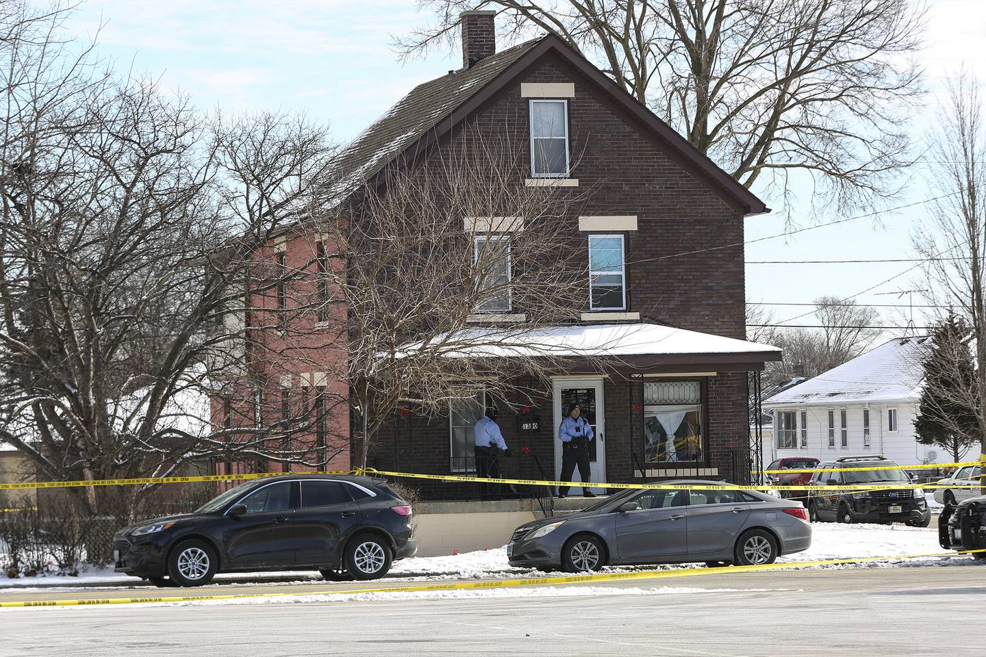 Police gather at the intersection of Ingalls Ave. and Nicholson St. after an officer involved shooting that took place on Thursday, Jan. 28, 2021, in Joliet, Ill.