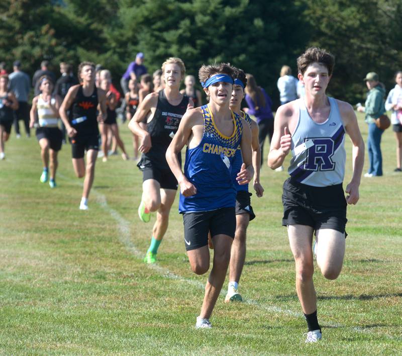 Rochelle’s Declan McGee races Aurora Central's A.J. Viveros to the finish line of  the Oregon Cross Country Open on Saturday, Sept. 6, 2025 at Oregon Park West.