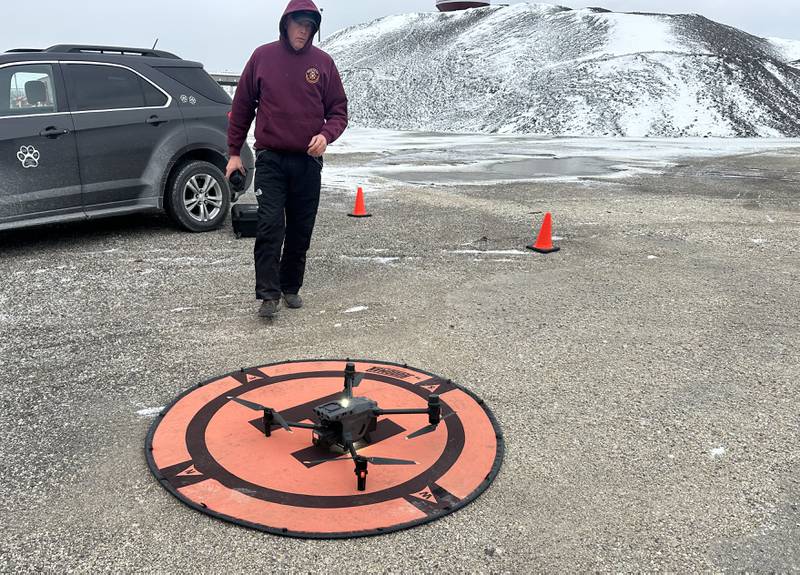 Philp Foree, with Eye in the Sky, replaces a battery in this thermal drone to help search the lot of Advanced Asphalt on  Wednesday, Jan. 14, 2026 in Utica. A search party was organized by the family of Villa Herrera who went missing on Sunday.  Herrera, was last seen after being involved in a crash at the Utica roundabout on Sunday. He was last spotted walking on foot and wearing a white an grey windbreaker jacket and jeans.