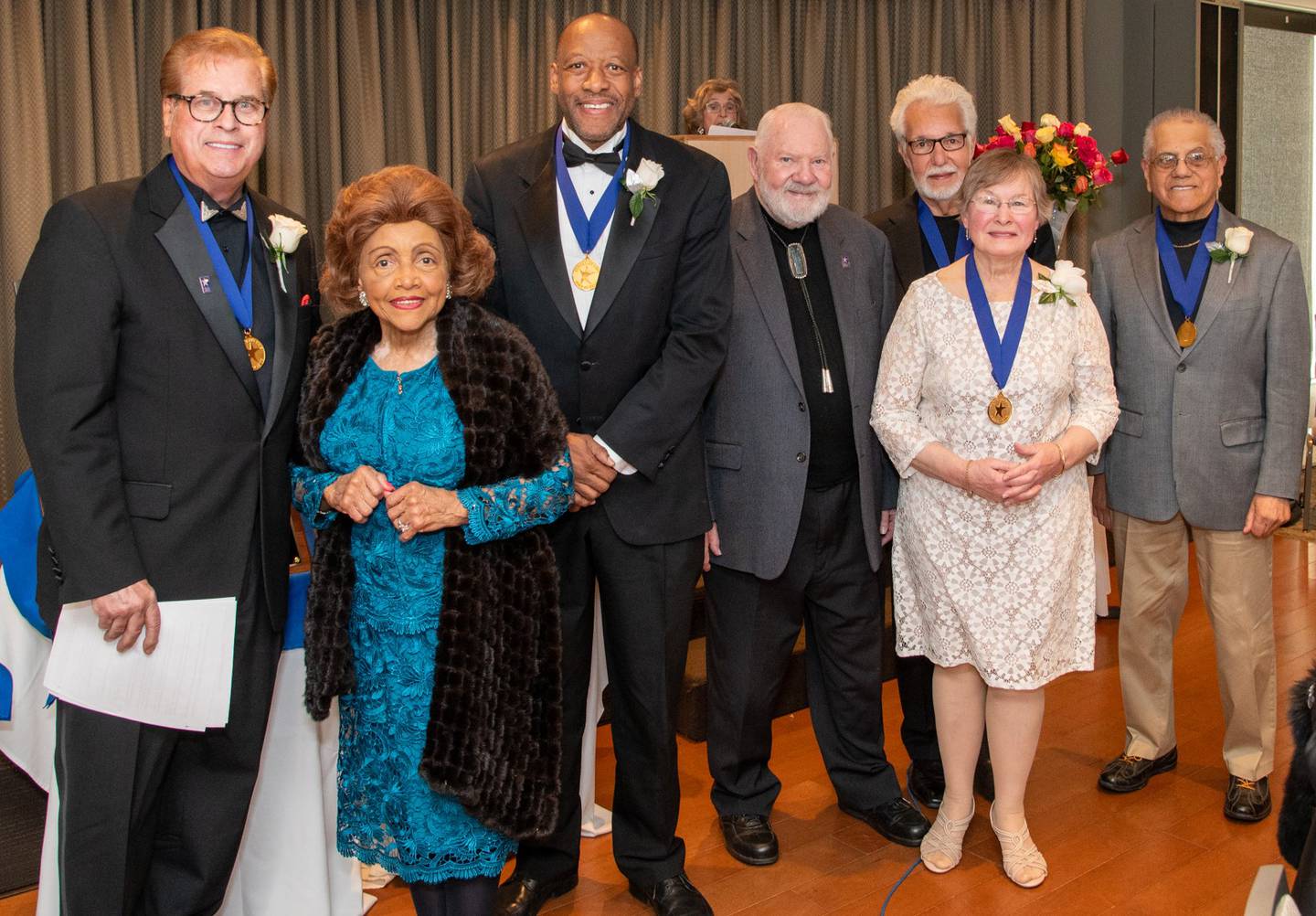 Photo credit: James Harvey Photography / April 19 2024.  Prior classes Fox Valley Arts Hall of Fame members: (l to r) Jim Gibson, Betty Brown for Floyd Brown, Huntley Brown, Edward Cook, Bobbie Brown, George Shipperley and Joseph Hernandez