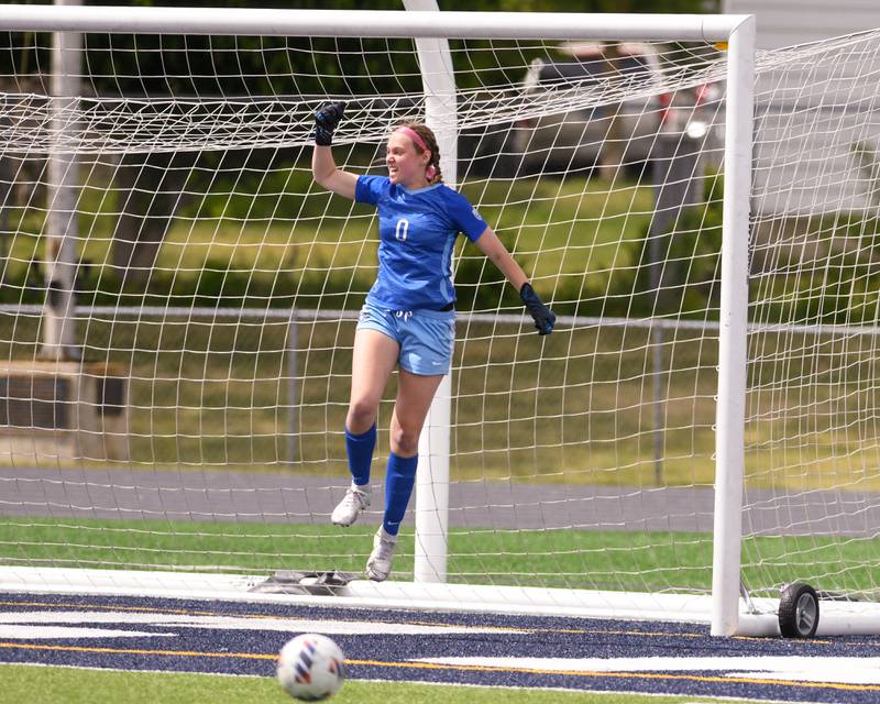 St. Charles North goalkeeper Kara Claussner celebrates after making a save during the penalty kick portion of the sectional title overtime game held on Saturday May 27th at West Chicago Community High School.