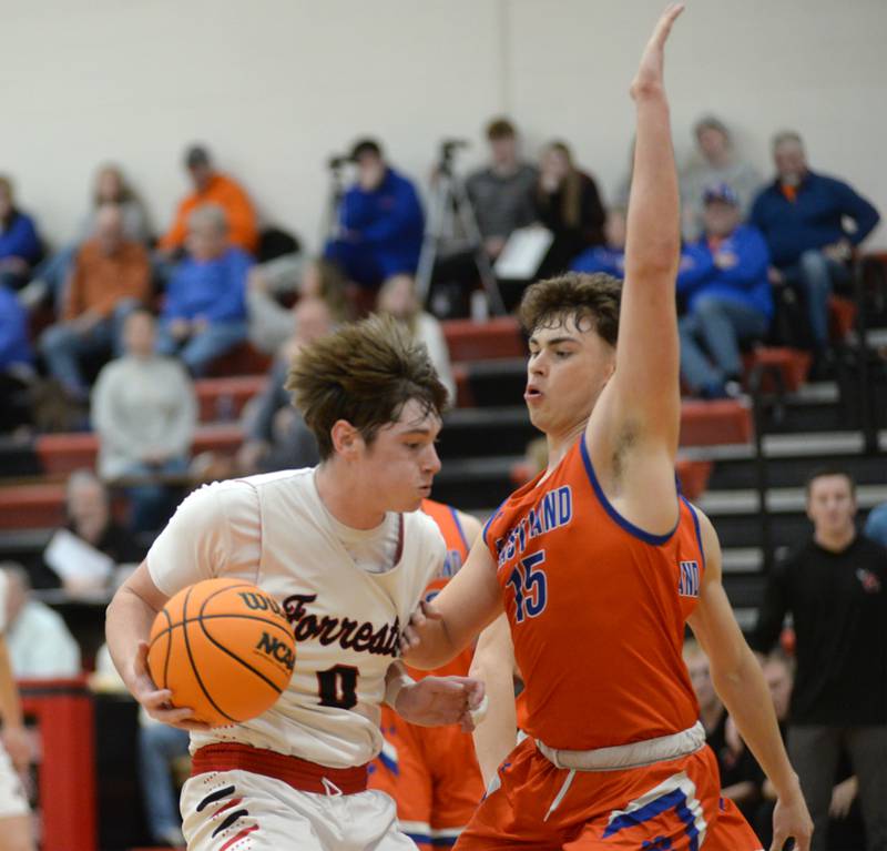 Forreston's Brendan Greenfield (00) drives to the basket as Eastland's Brayden Jackson (15) defends on Saturday, Jan. 4, 2025 at Forreston High School.