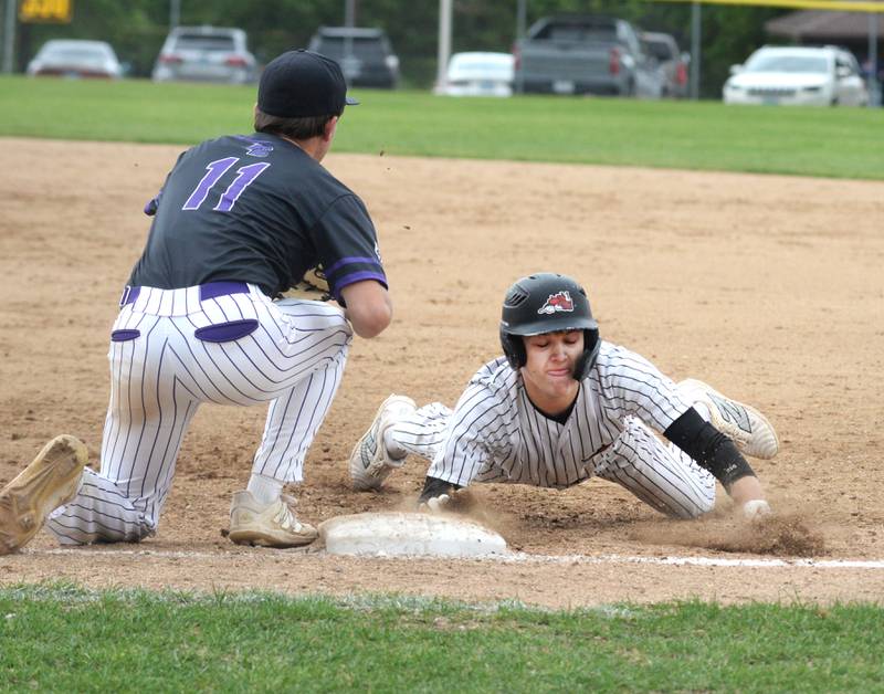 Fulton's Caden Wilkin dives back to first base ahead of the throw against Rockford Lutheran at the 1A Lena-Winslow Sectional on Wednesday, May 28, 2025.