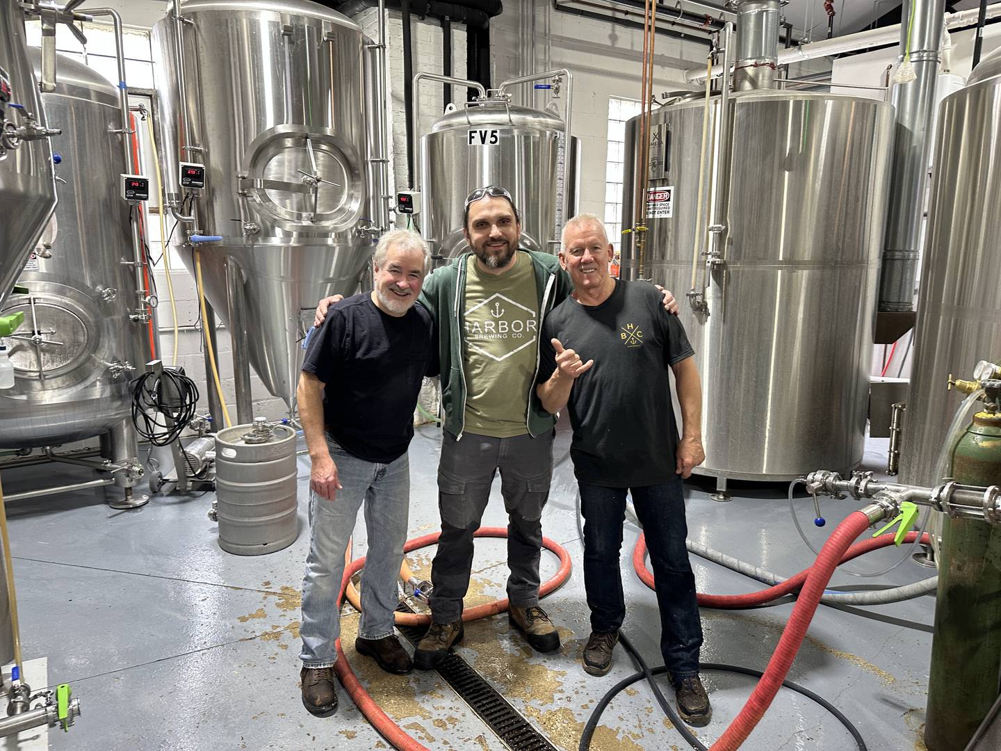 Brew Assistant Bill Curry (left), Head Brewer Adam Brose and Brew Assistant Jim Marks of Harbor Brewing Co. crafted two new beers inspired by superheroes and villains.