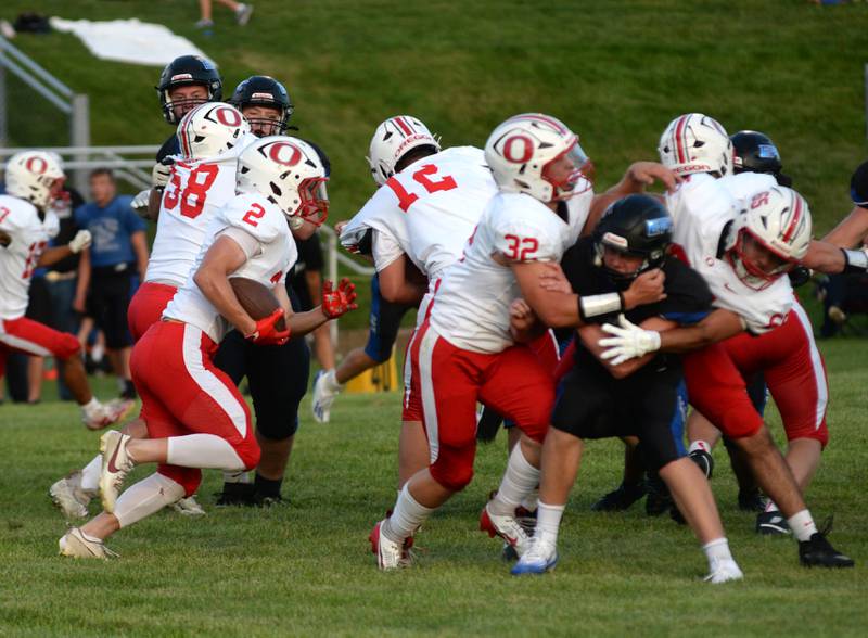 Oregon's Cooper Johnson runs for a gain as Jakob Moser (32) blocks during a practice game with Eastland-Pearl City on Friday, Aug. 22, 2025 at Lanark. The Hawks open the 2025 season at Genoa-Kingston on Friday, Aug. 29.