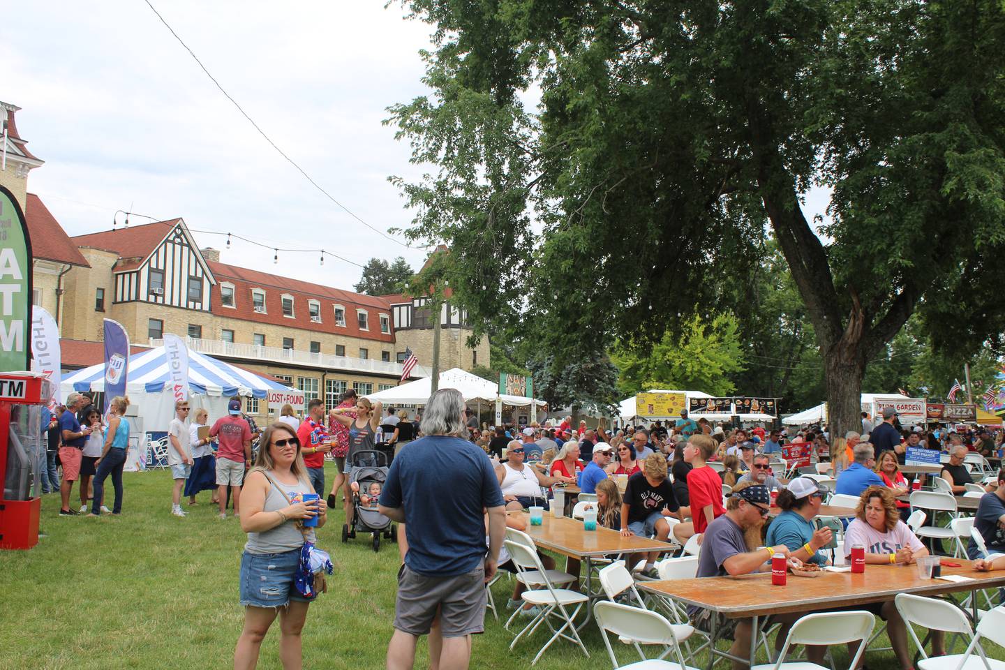 The crowd listens to Johnny Russler & The Beach Bum Band perform at Lakeside Festival at the Dole Mansion in Crystal Lake July 4, 2024.