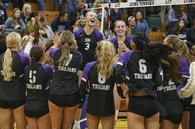 Downers Grove North celebrates their win over Downers Grove South in the Class 4A Lyons Sectional Semifinal volleyball match. Nov 4, 2025 in La Grange.