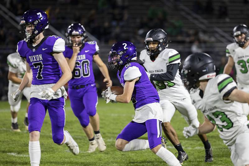 Dixon’s Jath St. Pier runs the ball early in the first quarter Friday, Oct. 21, 2022 against Rock Falls.