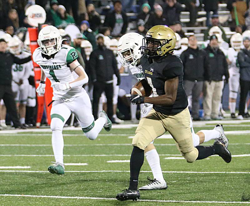 Sacred Heart-Griffin's Bill Sanders (1) sprints down the field to score a touchdown against Providence Catholic in the Class 4A state title on Friday, Nov. 25, 2022 at Memorial Stadium in Champaign.