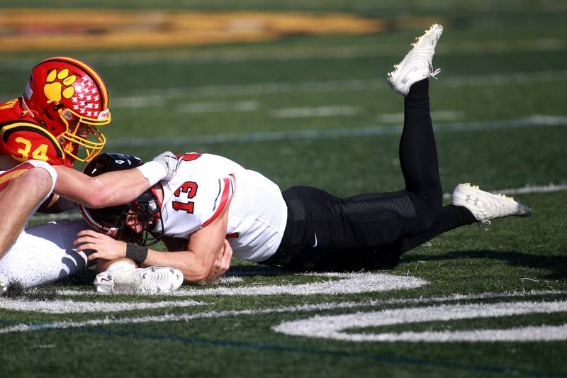 Lincoln-Way Central’s Michael Kuehl (right) is taken down by Batavia’s Ben Brown during the Class 7A second round playoff game in Batavia on Saturday, Nov. 4, 2023.