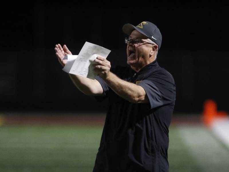 Richmond-Burton Head Coach Mike Noll yells as his offense during a Kishwaukee River Conference football game against Marengo on Friday, Oct. 17, 2025, at Richmond-Burton High School in Richmond.