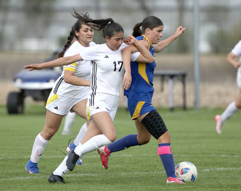 Harvard's Aimar Citlali Nava tries to slow down Johnsburg's Liz Smith during a Kishwaukee River Conference soccer match on Wednesday, April 27, 2026, at Johnsburg High School.