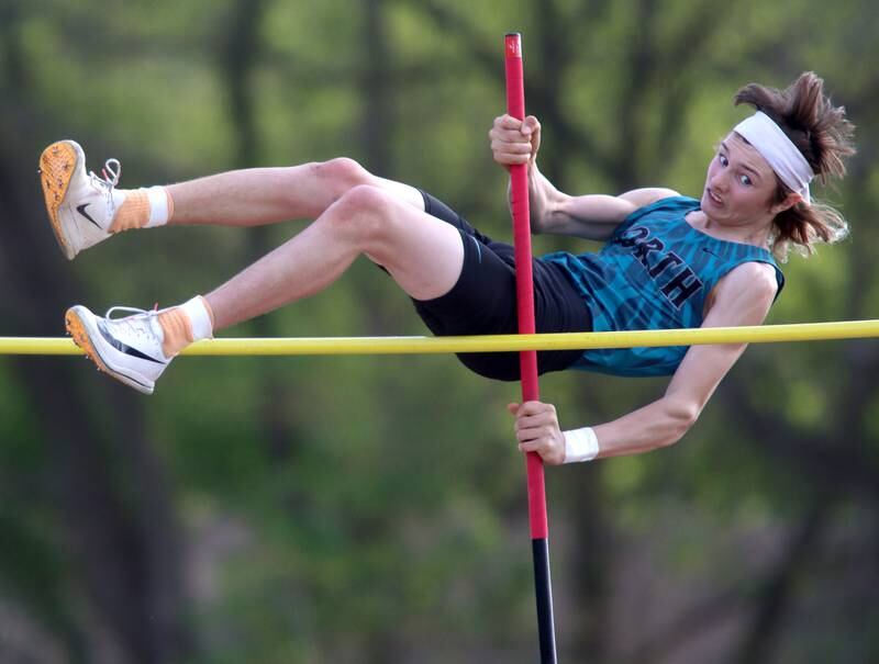 Woodstock North’s Braelan Creighton competes in the pole vault during Kishwaukee River Conference track meet action at Marengo Tuesday night.