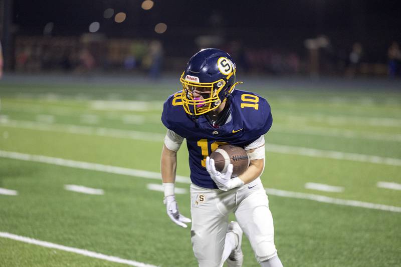 Sterling’s Joseph Duffy looks for running room after making a catch against Alleman Friday, Oct. 3, 2025.