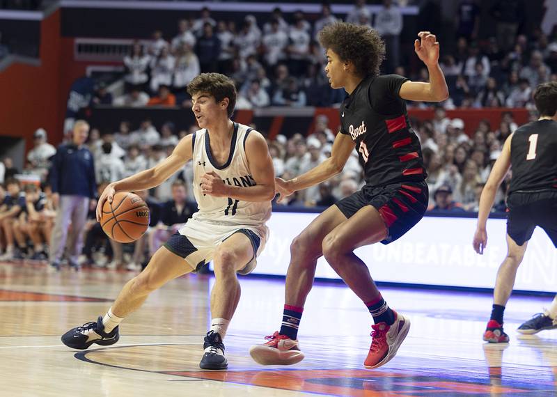 New Trier’s Evan Kanellos handles the ball against Benet Academy Friday March 10, 2023 during the 4A IHSA Boys Basketball semifinals.