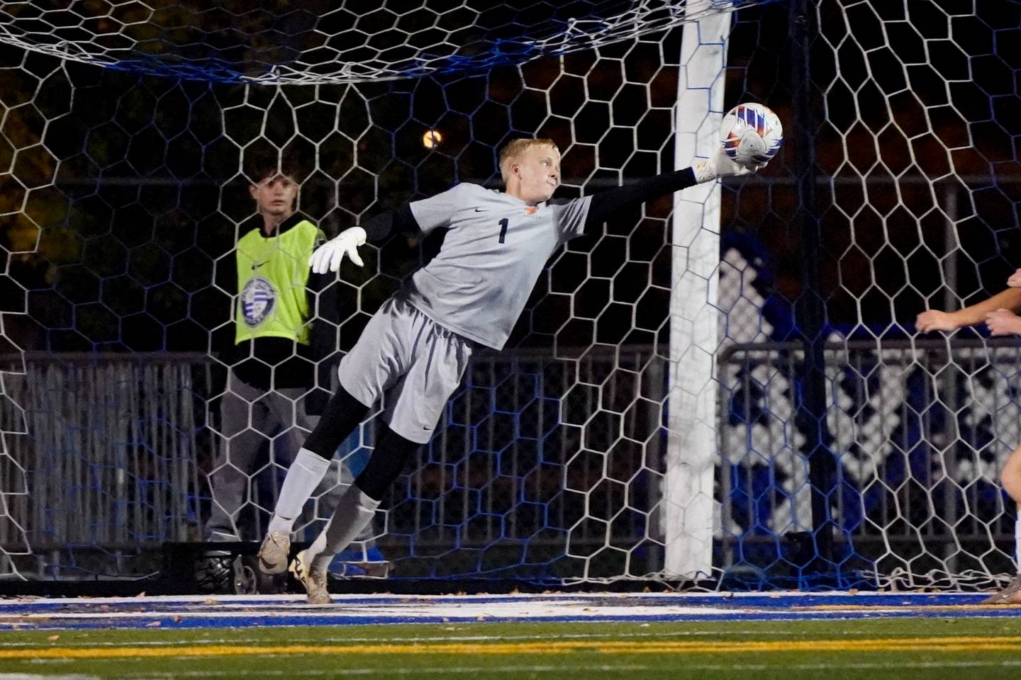 St. Charles East's Jason Striegel (1) makes a save against Geneva during a DuKane Conference game at Geneva High School on Tuesday, Oct. 14, 2025.