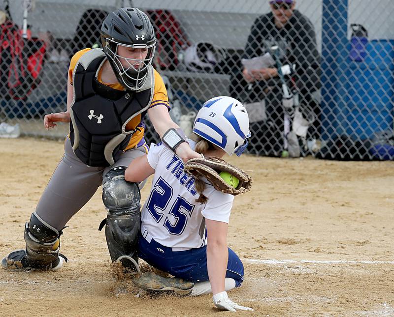 Princeton's Kelsea Klingenberg slides into home as Mendota catcher Emma Schultz applies the tag in Monday's regional quarterfinal.