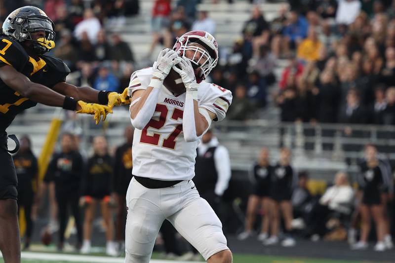 Morris’ Jack Wheeler pulls in a pass for a touchdown against Joliet West on Friday, Sept. 6, 2024 in Joliet.