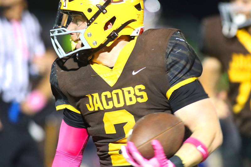 Jacobs’ Caden DuMelle runs the ball against Dundee-Crown in varsity football  at Jacobs High School in Algonquin on Friday, Oct. 10, 2025.