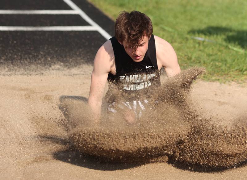 Kaneland's Logan Ehlers competes in the triple jump Friday, May 13, 2022, during the Interstate 8 Conference Championship meet at Sycamore High School.